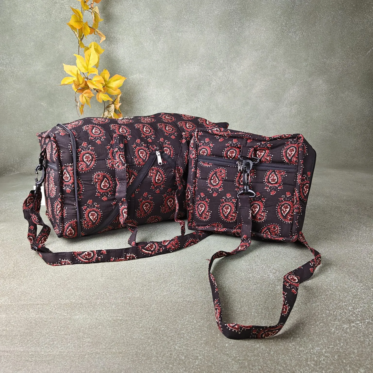 Expandable Travel Bag Black Colour with Red Mango Flower Printed Design.