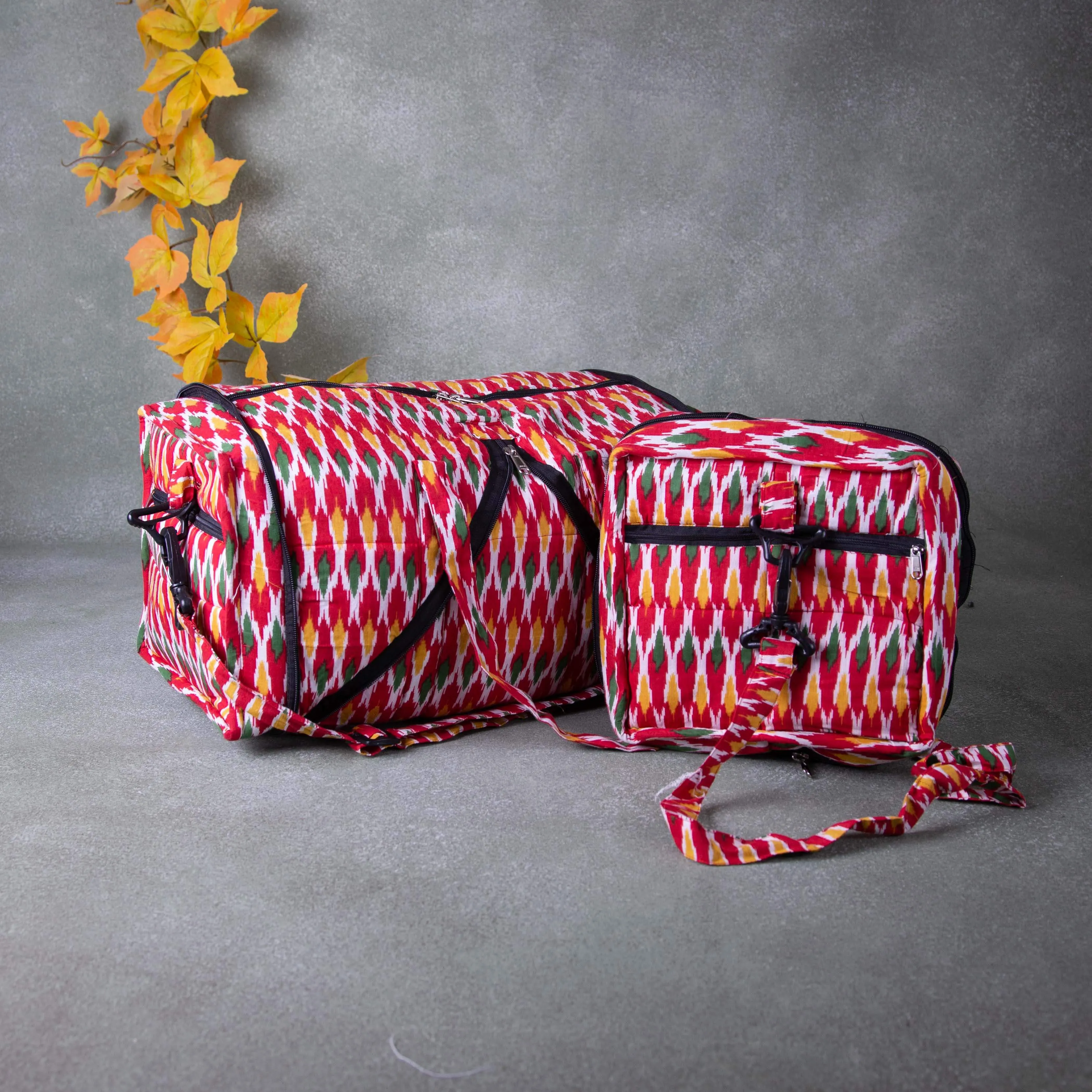 Expandable Travel Bag Red Colour with Yellowe Blue and Yellow Zig Zag Design.